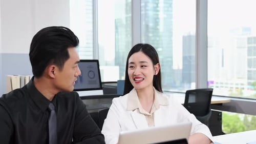 Business Colleagues Talking in Modern Office Environment