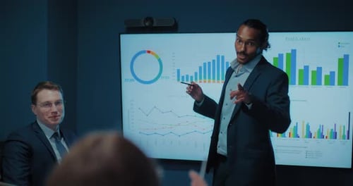 Business People at Tech Sales Presentation