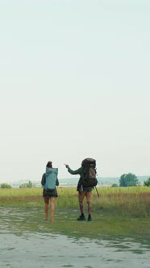 A Group of Young Adventurers Enjoying a Thrilling Hike Through Natures Beautiful Landscape