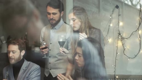 Group of Friends Eating, Drinking and Talking