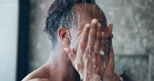 Person Washing Face in Shower, Close Up