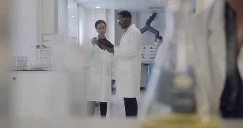 Scientists Reviewing Data in a Bright Modern Lab