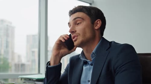 Confident Businessman Smartphone Conversation