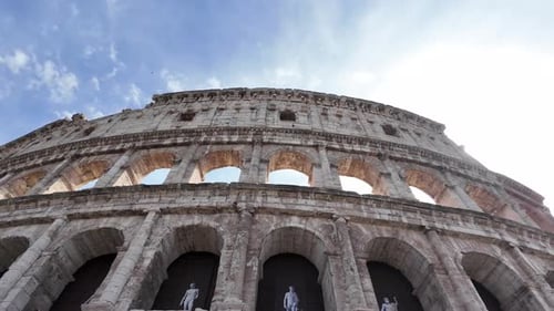 Colosseum Arches and Sculptures in Rome on Sunny Day