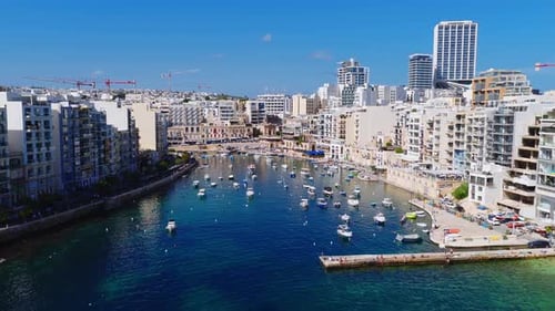 Aerial Midday View of Sliema Harbour Boats Towers and Cranes
