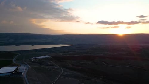 Rural Farmland and Lake at Golden Hour Sunset