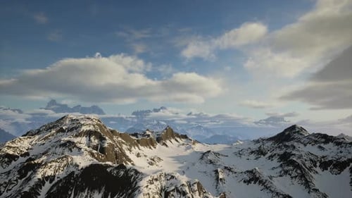 Majestic Winter Mountain Range Panorama Under a Blue Sky