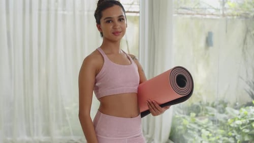 Portrait of Cheerful Girl with Yoga Mat