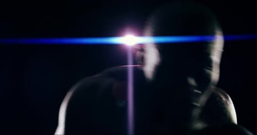 4k video footage of an athletic young man against a black background