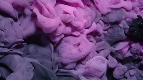 Black and Pink Paint Creating Abstract Clouds