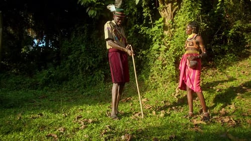 Cheerful Karamojong Man And Woman Dancing Outdoors In Uganda, Africa - Wide Shot