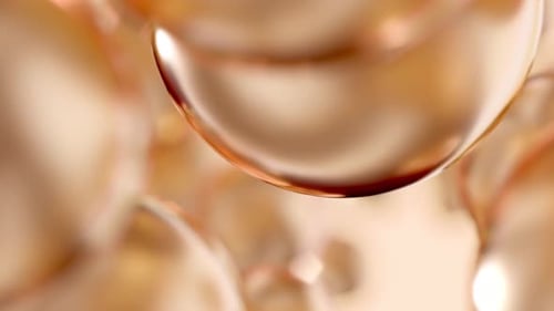 Golden Cosmetic Beauty Care Essential Oil Bubbles Macro Close-Up