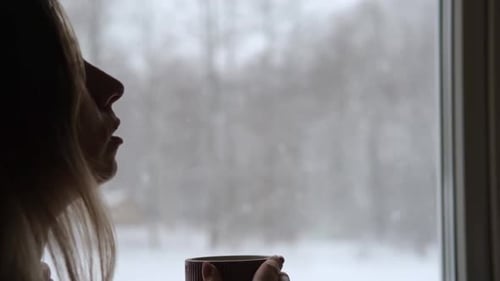 Long Hair Woman Standing Among the Window and Drinking Hot Tea From Mug Winter Landscape Lady Drinks