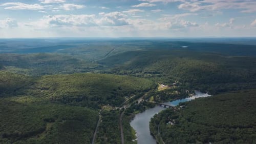 Aerial hyperlapse over river in the mountains