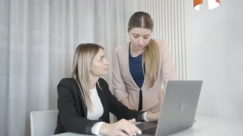 Two Women Have a Serious Discussion on the Computer