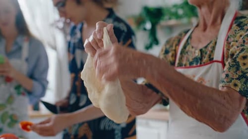 Family Baking Dough Together in Bright Kitchen
