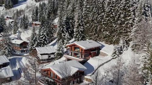 Snow-Covered Chalet In Lengau, Saalbach Hinterglemm, Austria. Aerial Drone Shot