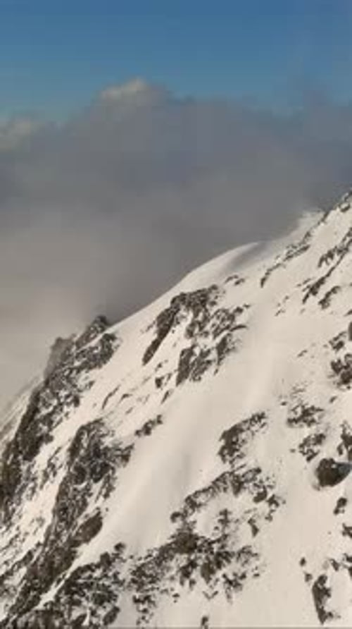 Snowy Mountain Peak Above the Clouds. British Columbia, Canada.