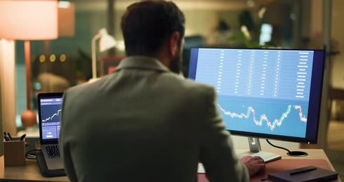 Businessman, night or back with screen for stock market trading, data or statistics in office
