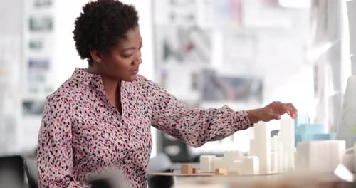 Architect working on scale model