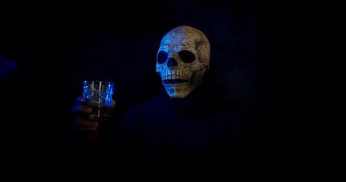 Man In Halloween Costume Drinking