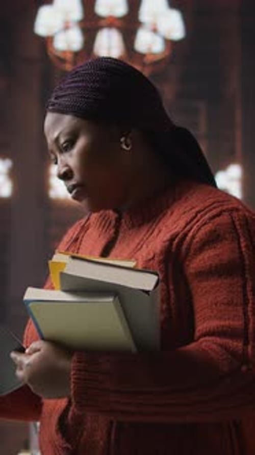 Vertical Video Female Educator Preparing Her Teaching Materials and Resources in the Library