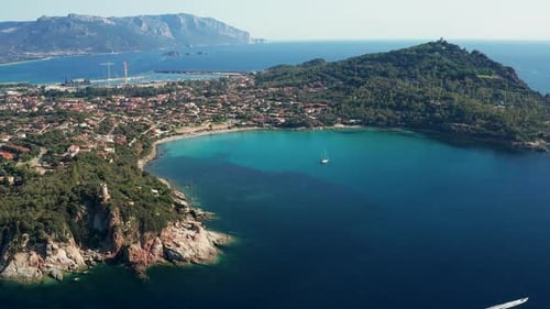 Aerial view of coastline and turquoise sea, Italy.