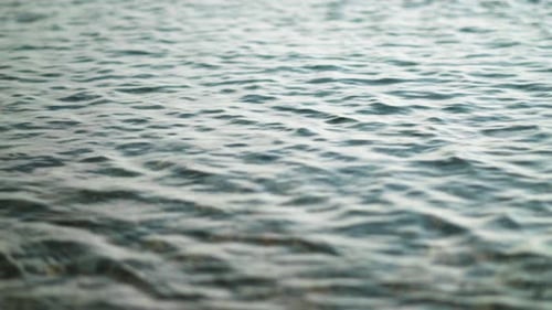 Shallow waves rippling on beach, tidal water motion background
