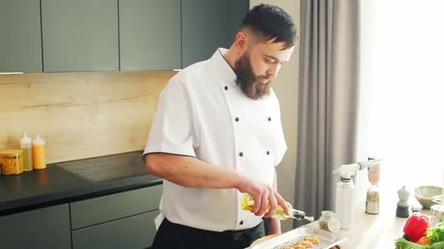Chef Prepares Salmon in Modern Kitchen