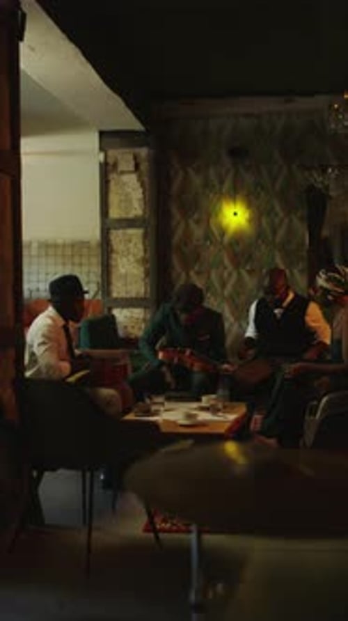 Live Musicians Play Instruments at Night in Urban Cafe