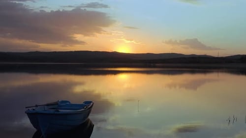 Golden Fire Sunset at lake with yellow and orange reflection on water
