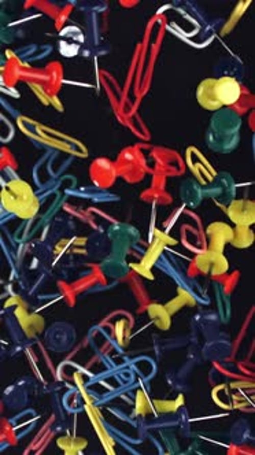 Multicolored Paper Clips Fly Up and Fall Down Filmed on a Highspeed Camera at 1000 Fps