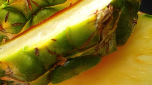 A tantalizing macro adventure. Watch as a succulent pineapple slice