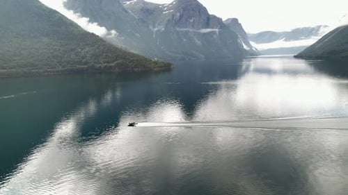 Aerial Panoramic View of Motorboat Navigating Fast On Eikesdalsvatnet Lake In Norway