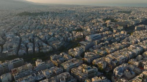 Aerial shot towards large highway passing through central Athens