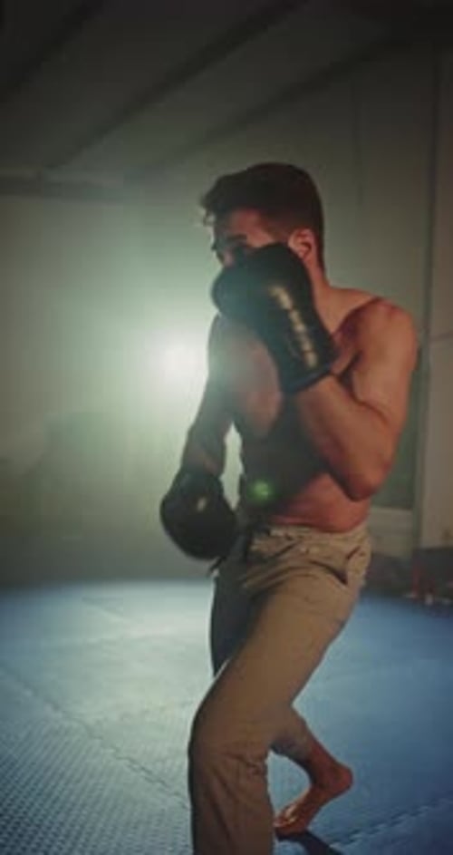 Man Working Out Punching a Punching Bag