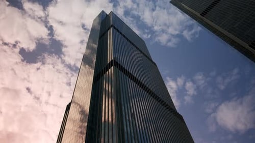 Bottomup View of Huge Mirrored Skyscraper Against Sunset Sky Business Offices in Large Building