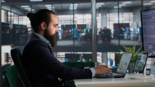 Professional Bearded Man Working in Modern Office