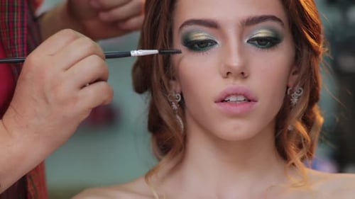 Makeup Artist Applying Eyeshadow for Beauty Makeup Model Closeup Eyes Eyeshadow Beautiful Young