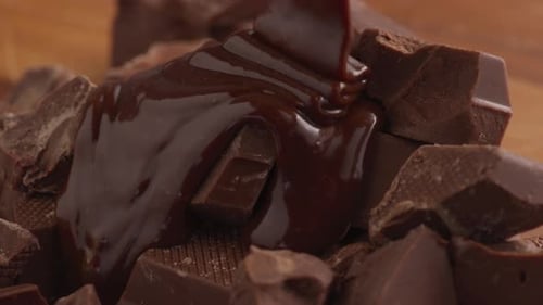 Delicious Molten Chocolate Being Poured Over Chocolate Chunks