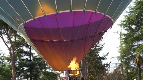 Hot Air Balloon Inflation: Flame Ready to Lift into Spring Sunny Blue Skies