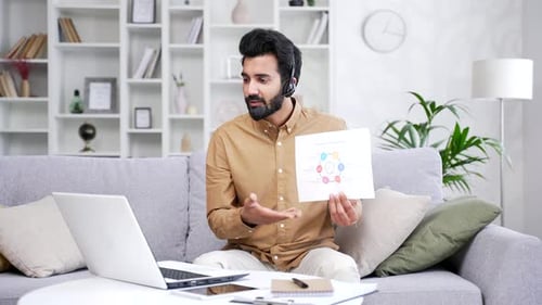 Man Presenting Graph During Online Video Conference