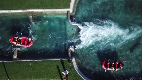 Aerial top shot of 2 rafting boats on Raging River with Rapids in 4K