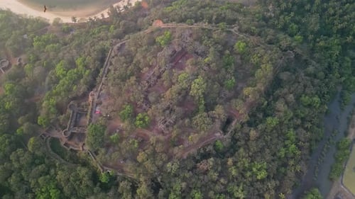 Red Stone Fort Entrance Overlooking Tropical Forest in Goa
