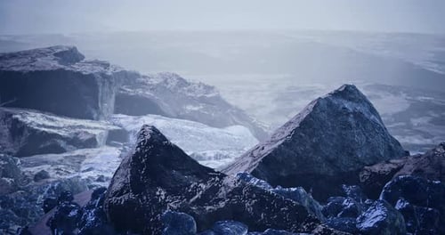 Mysterious Rocky Landscape with Fog and Shadows in an Otherworldly Setting
