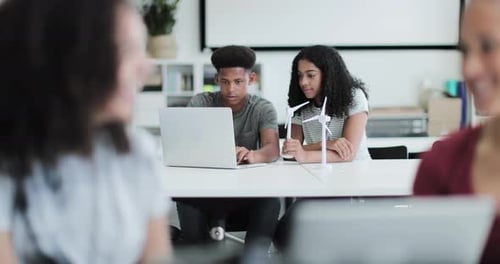High school students studying renewable energy