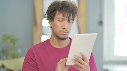 Man Using Tablet Device Indoors