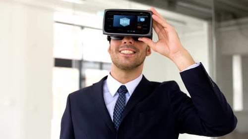 Man smiling wearing virtual reality headset in office