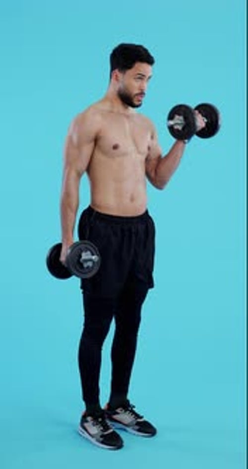 Man Lifting Weights Doing Bicep Curls