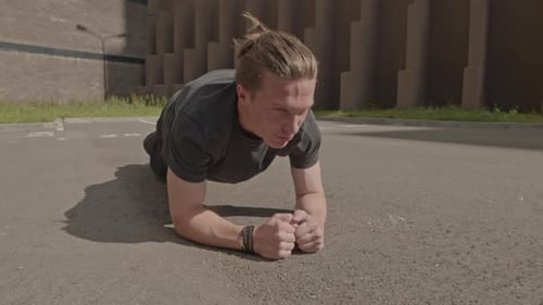 Fit Man Doing Plank Exercise in Urban Setting